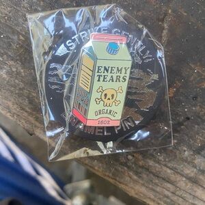 Brand New In Package Organic Enemy Tears Strike Gently Enamel Pin w/Locking Back